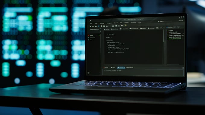 close-up-code-running-laptop-screen-data-center