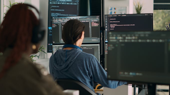 database-programer-writing-code-terminal-window-using-multiple-monitors-it-agency-office-system-software-developer-typing-database-information-computing-big-data-script