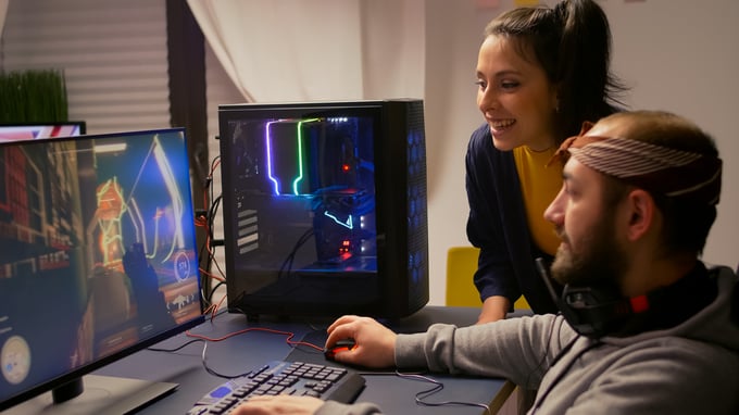 pro-gamer-couple-playing-first-person-video-game-powerful-computer-wearing-professional-headphones-videogamer-streaming-gameplay-cyber-game-sitting-gaming-chair-using-rgb-equipment