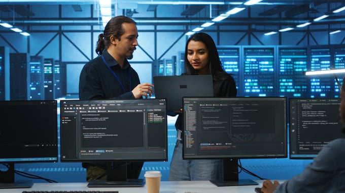 programmer-supervisor-server-room-doing-brainstorming