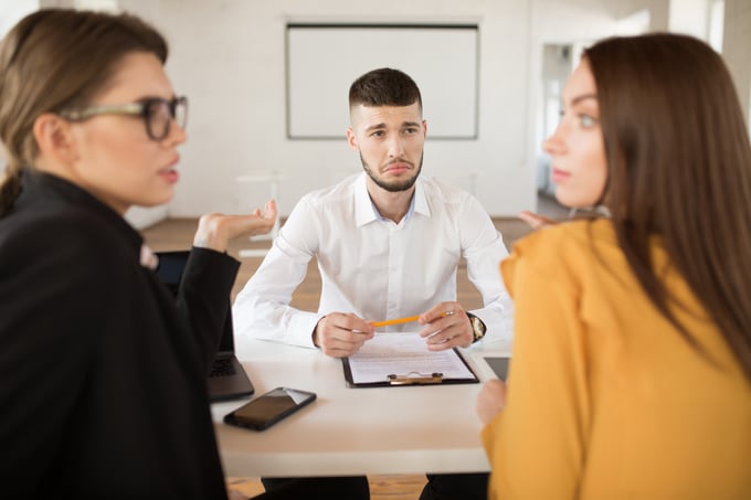 young-upset-man-white-shirt-sadly-looking-employers-while-spending-time-modern-office-male-applicant-waiting-results-job-interview